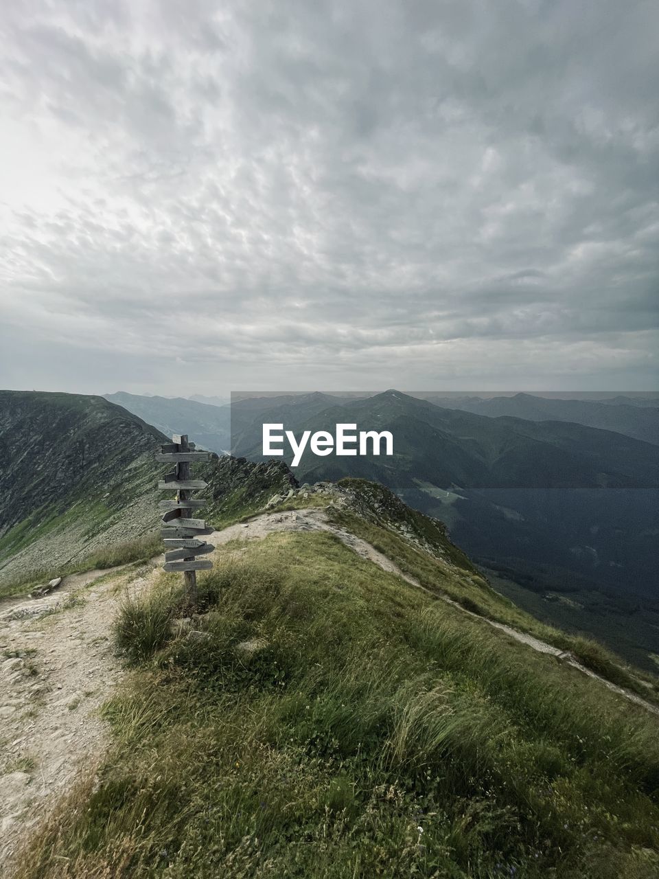 environment, landscape, sky, cloud, scenics - nature, mountain, nature, beauty in nature, ridge, land, plant, mountain range, grass, tranquility, travel, non-urban scene, tranquil scene, plateau, travel destinations, outdoors, tourism, highland, no people, leisure activity, day, activity, overcast, mountain pass, rural scene, green, meadow, terrain, vacation, trip, holiday, rural area, fog, idyllic, remote, valley