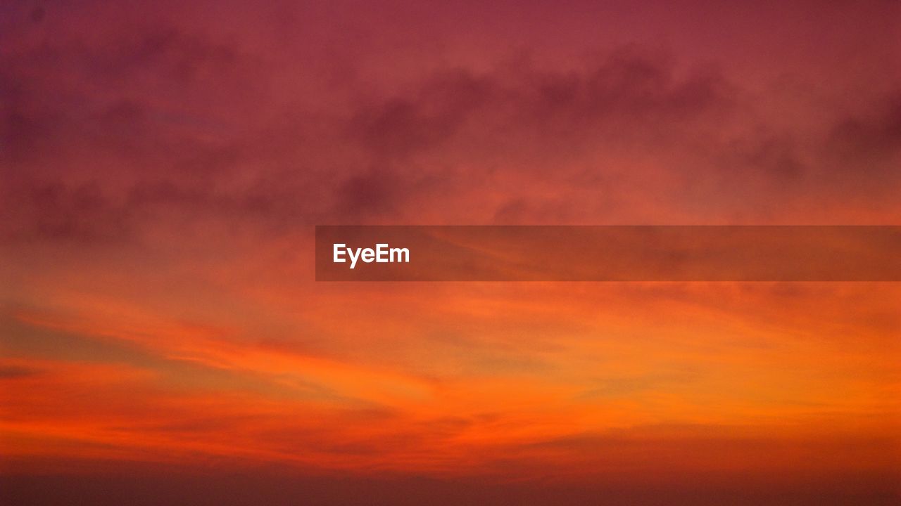 Low angle view of dramatic sky during sunset
