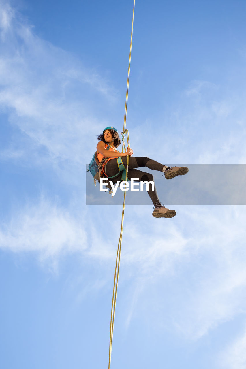 Young woman abseiling on chulilla canyon (spain)