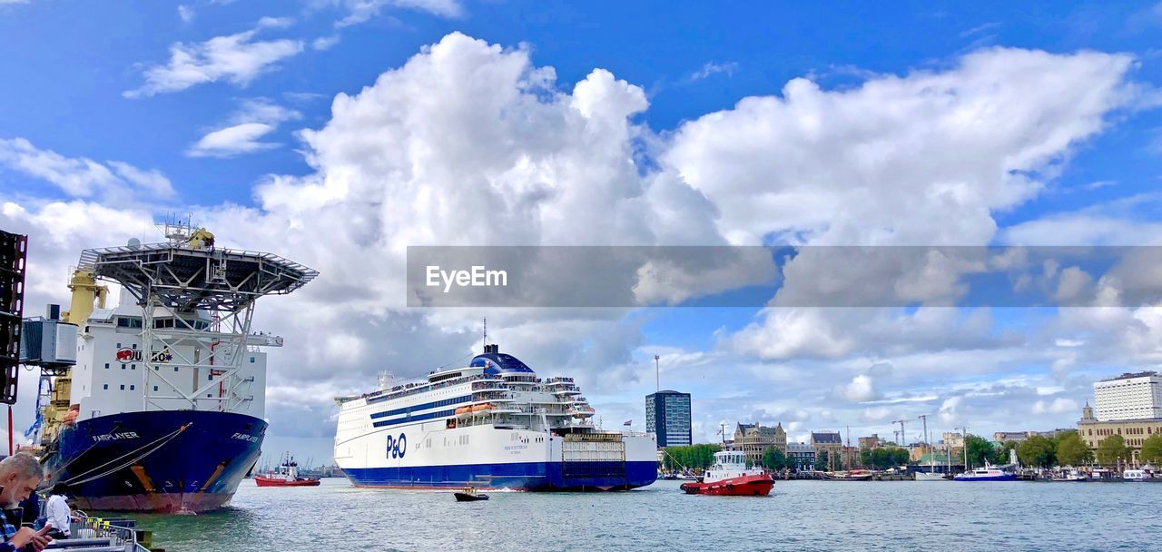 PANORAMIC VIEW OF SHIP MOORED AT SEA AGAINST SKY