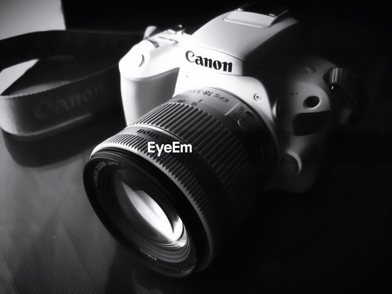 HIGH ANGLE VIEW OF CAMERA ON TABLE AT NIGHTCLUB