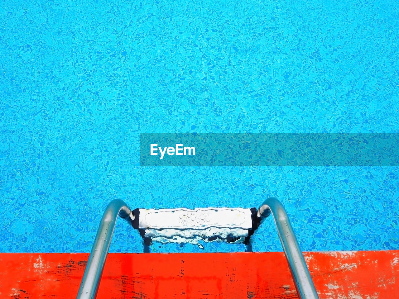 High angle view of stainless steel ladder in swimming pool
