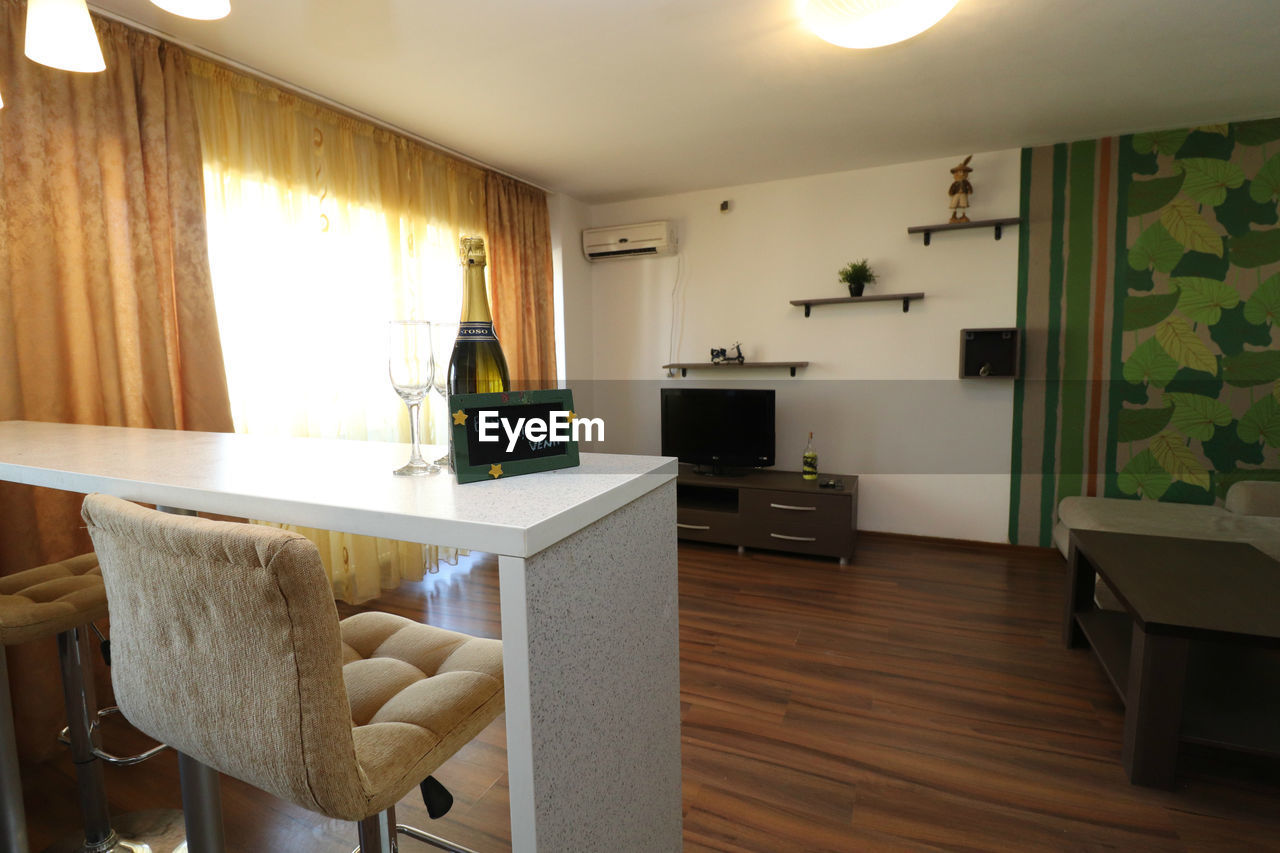 WOODEN TABLE IN ROOM