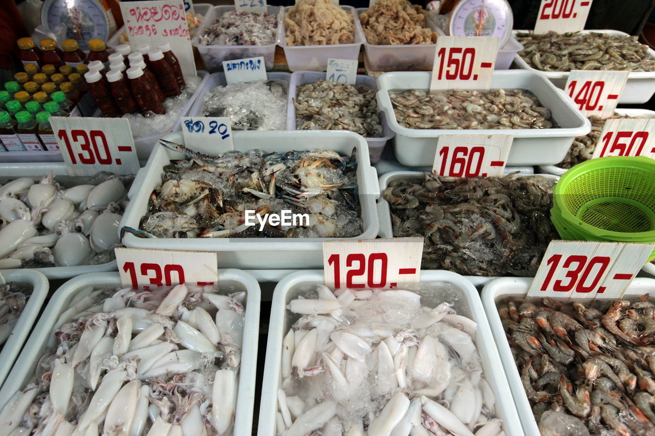 High angle view of seafood with price tag at market