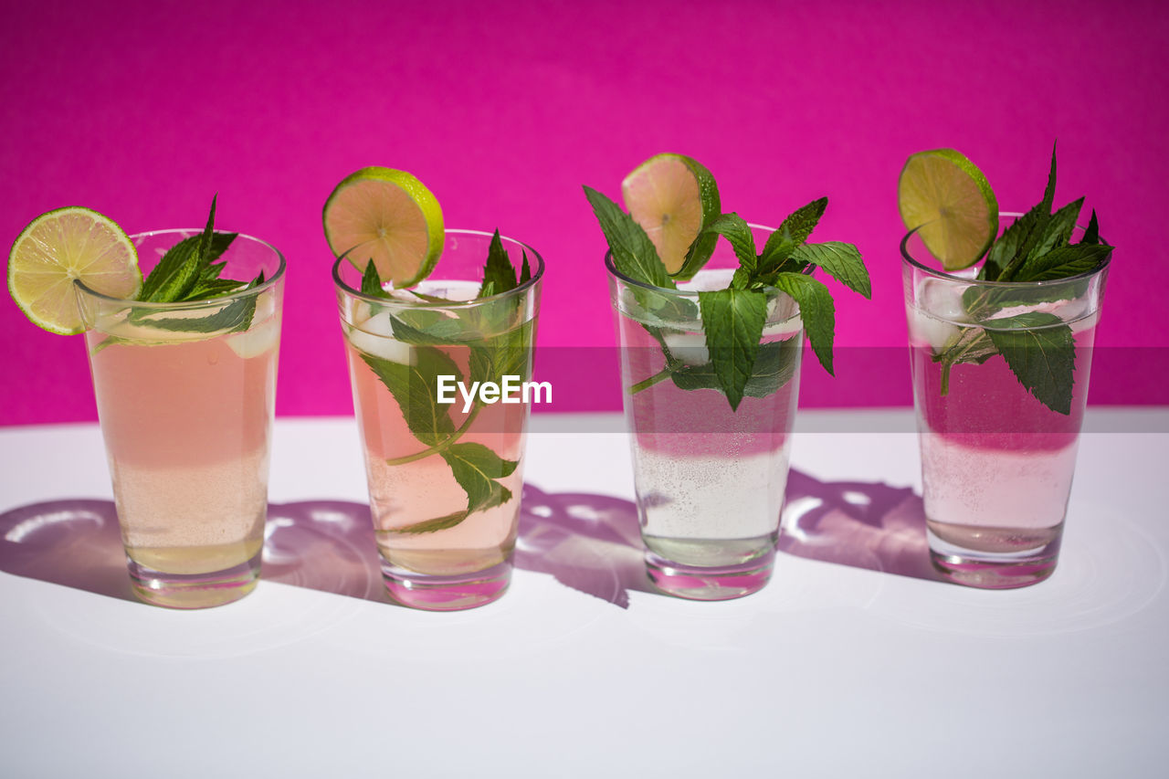 Close-up of four glasses of mojito