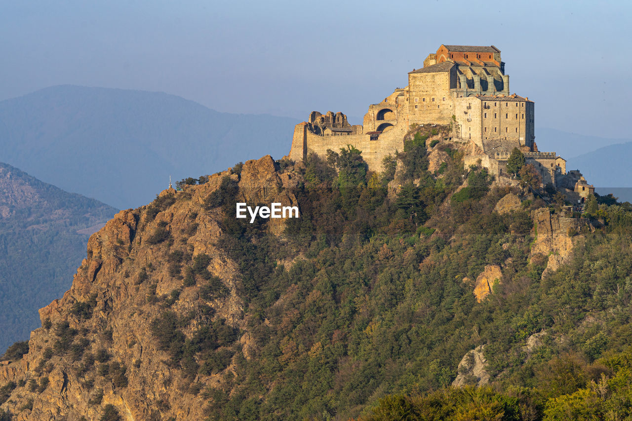 Sacra di san michele abbey in autumn season, a popular tourist attraction in piedmont region, italy