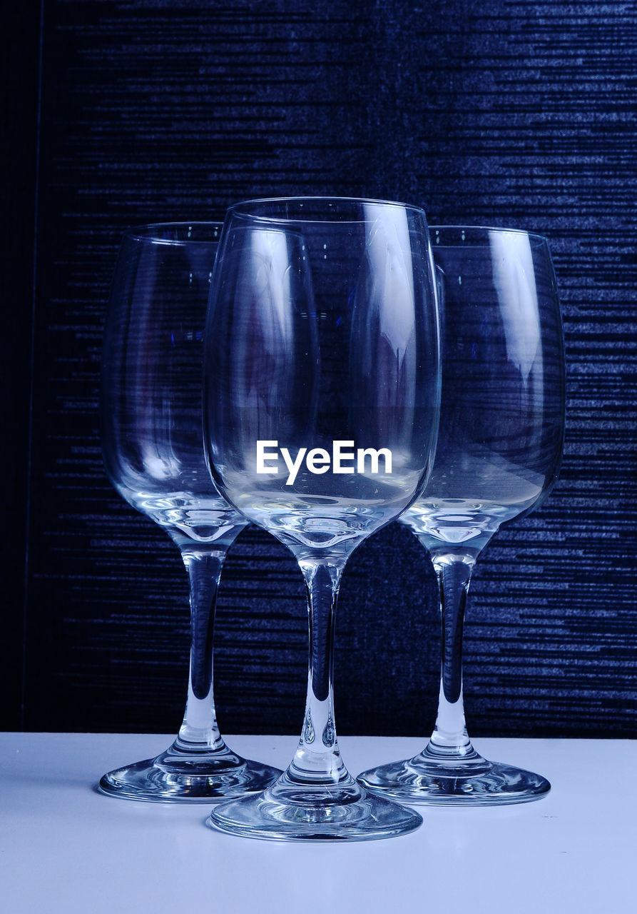 Close-up of wineglasses on table