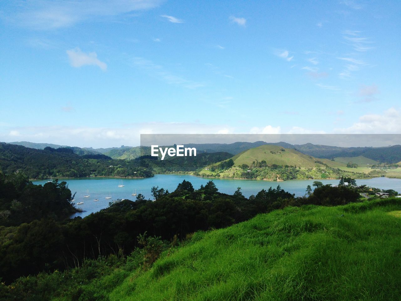 Scenic view of lake against cloudy sky