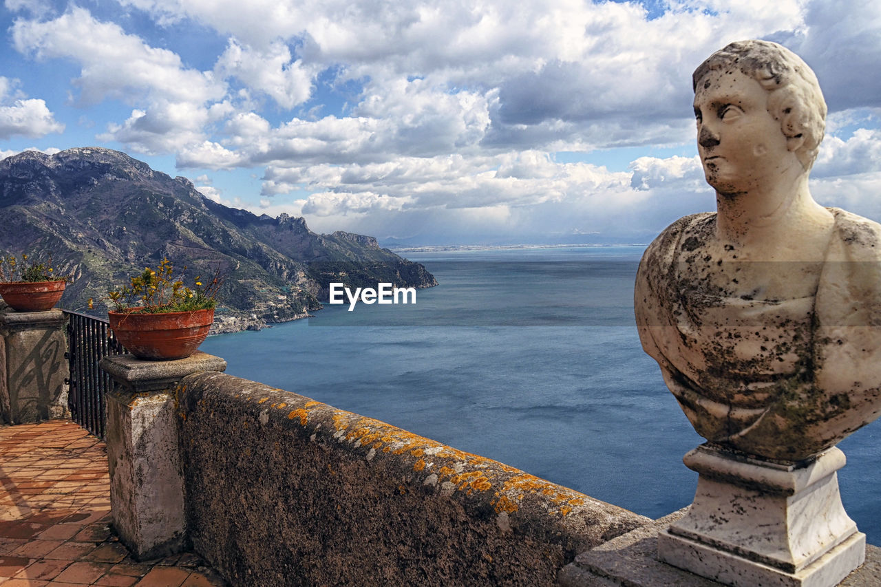 STATUE OF SEA AGAINST SKY