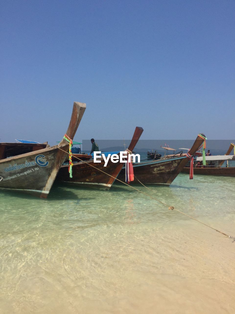 BOATS IN SEA AGAINST CLEAR SKY