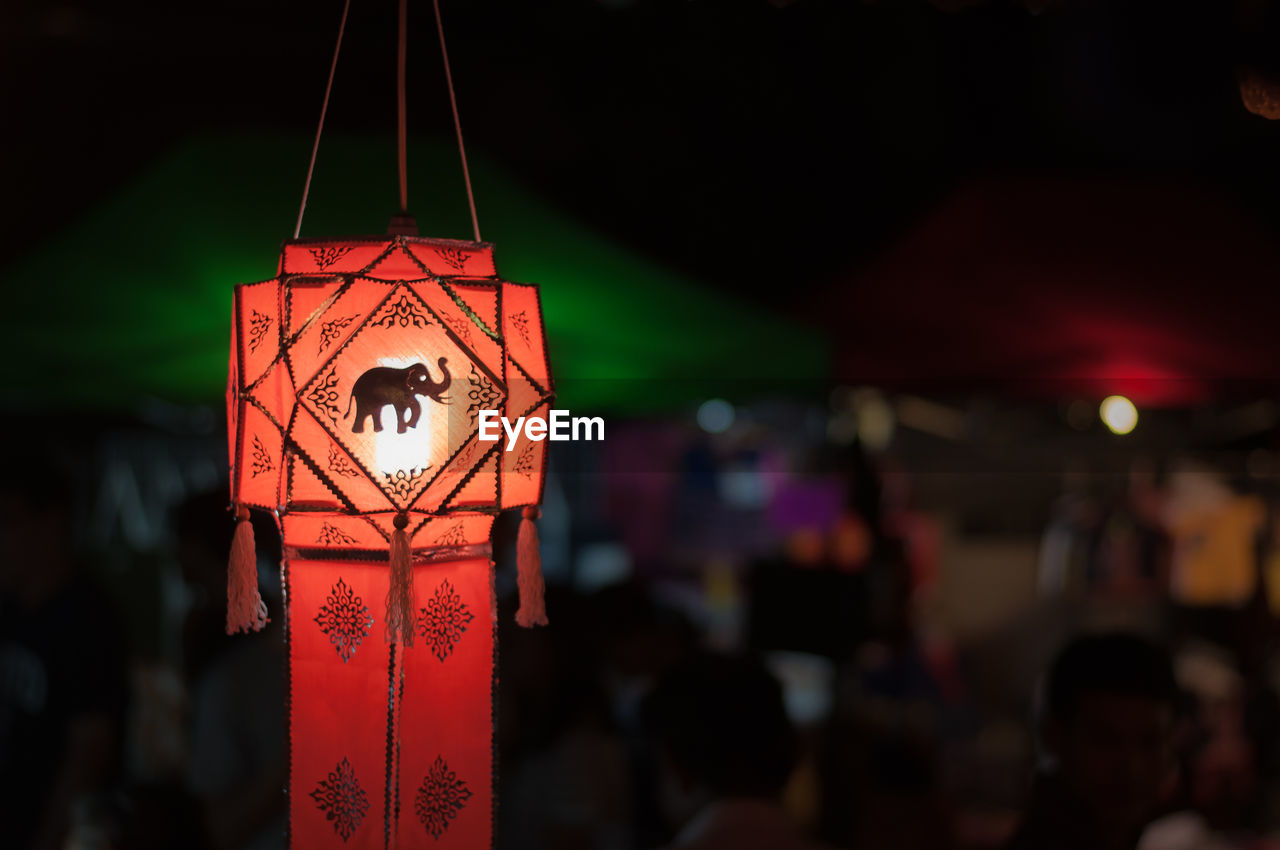 Close-up of illuminated lantern hanging at night