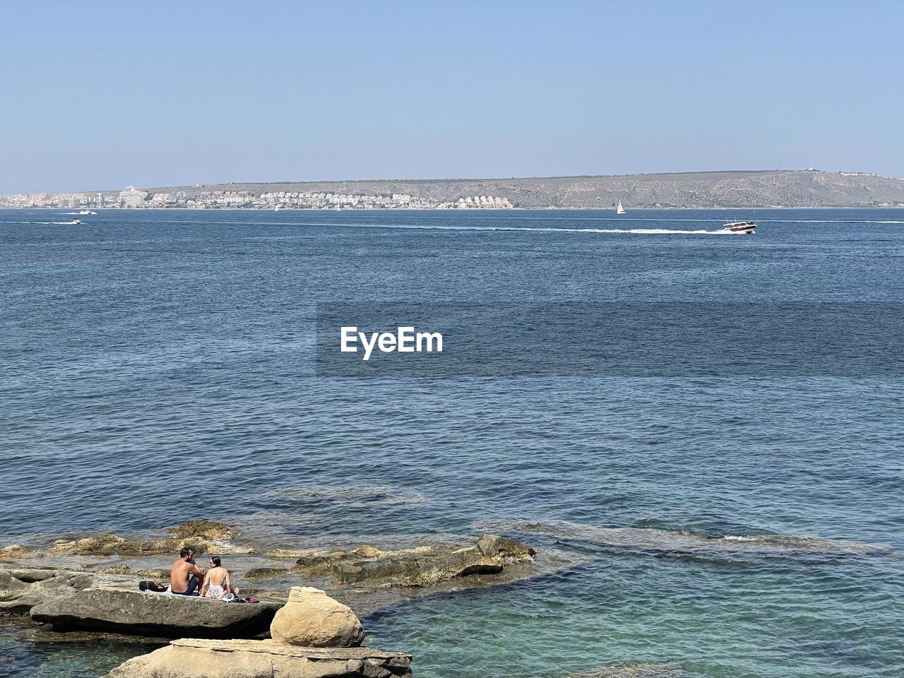 Scenic view of sea against clear sky