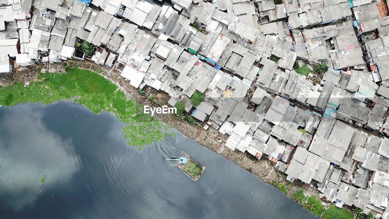 High angle view of river by buildings in city