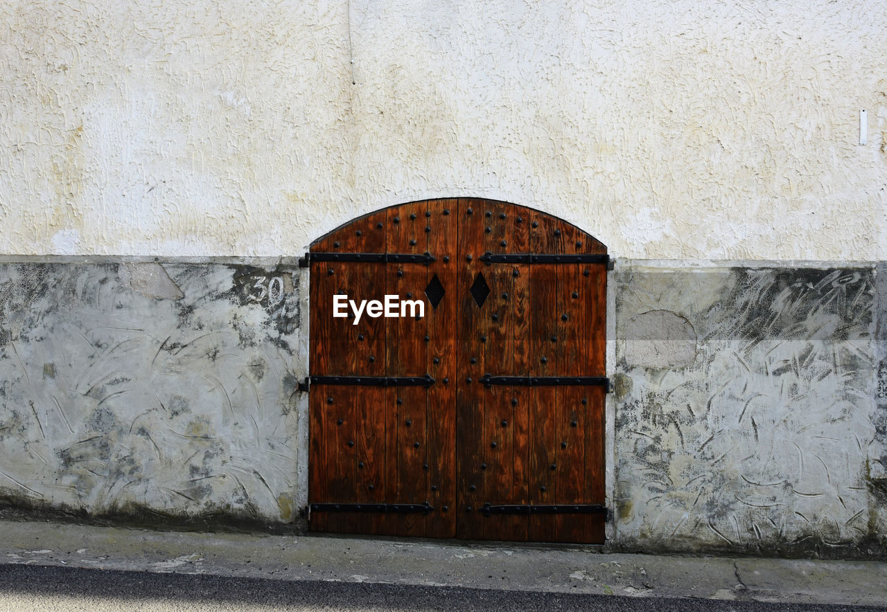 architecture, built structure, entrance, door, closed, wall, building exterior, wall - building feature, no people, day, wood, protection, building, security, iron, outdoors, city, old