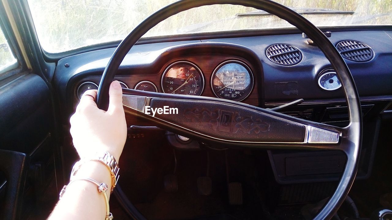 CLOSE-UP OF HAND ON CAR