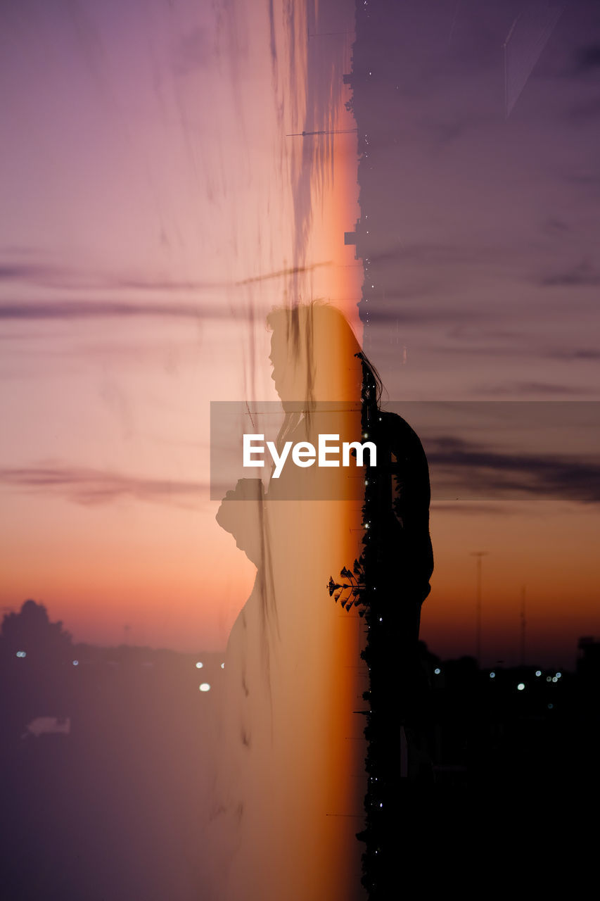 Double exposure of man and sunset view skyline night lights