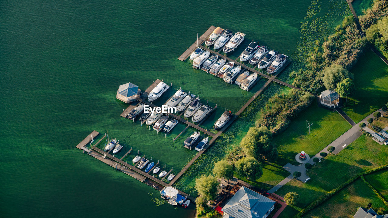 High angle view of buildings by sea