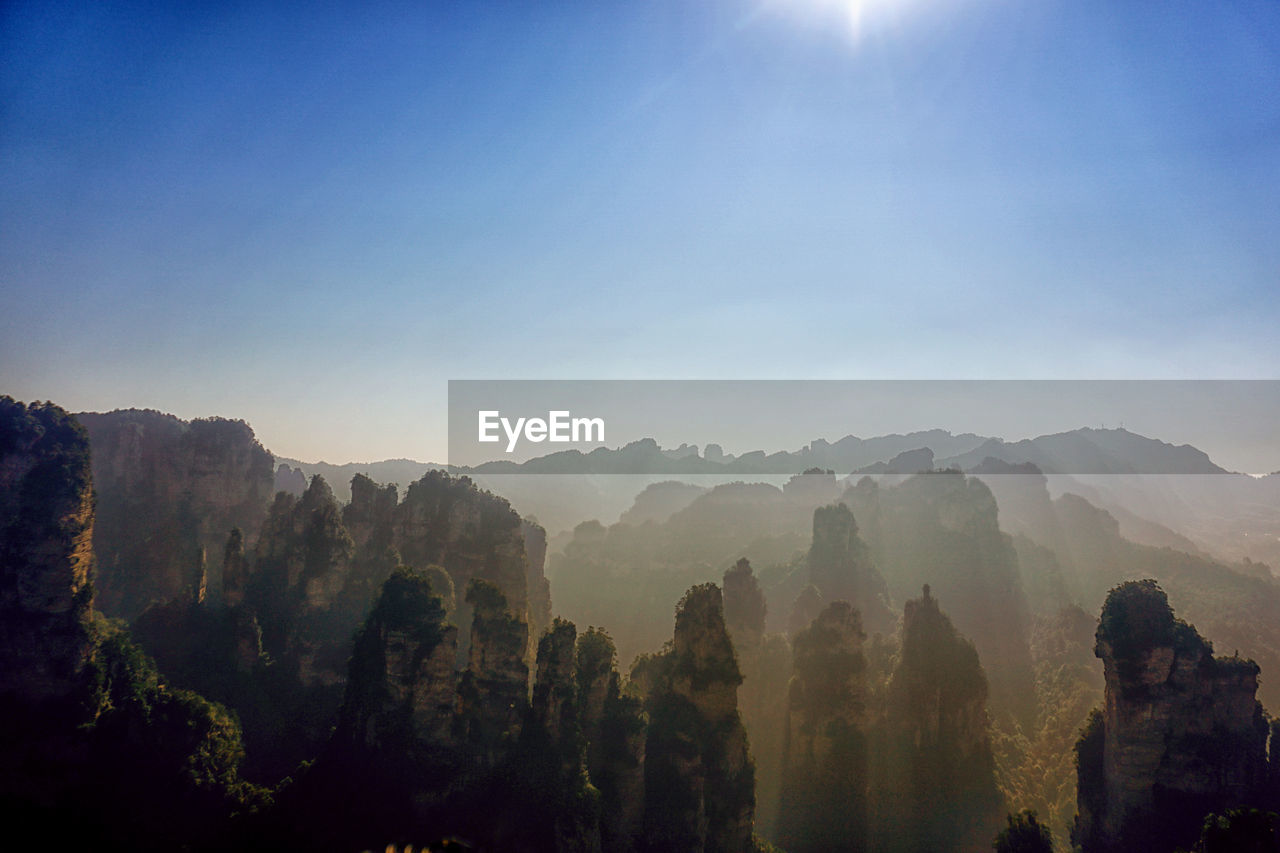 Scenic view of tianzi mountain against blue sky