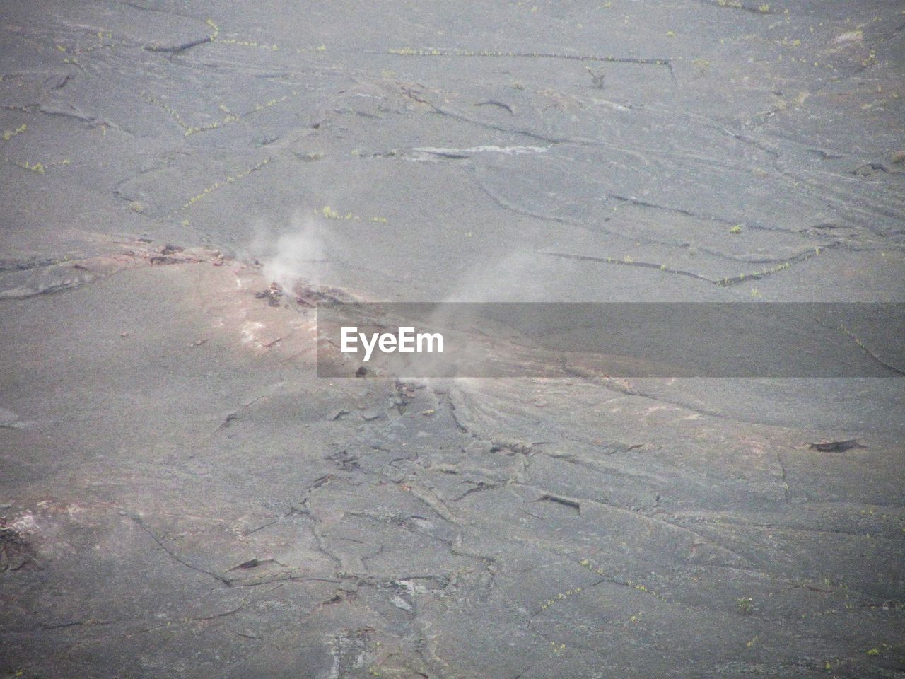 HIGH ANGLE VIEW OF WATER ON SHORE