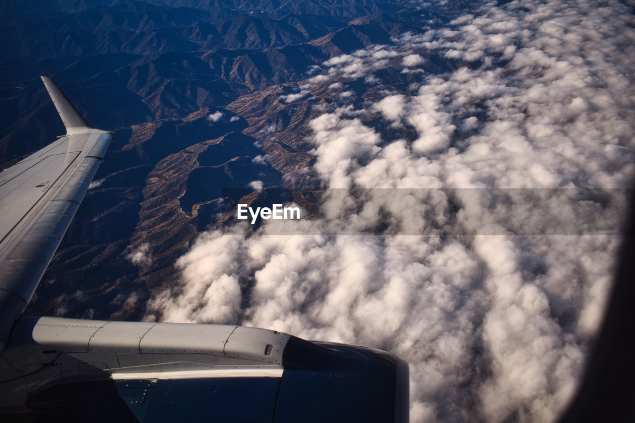 View of the hills from the window of an airplane