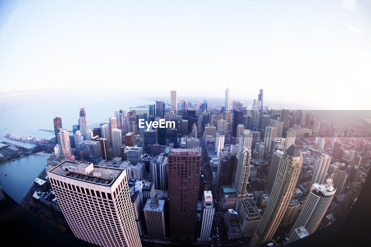 AERIAL VIEW OF MODERN BUILDINGS AGAINST SKY