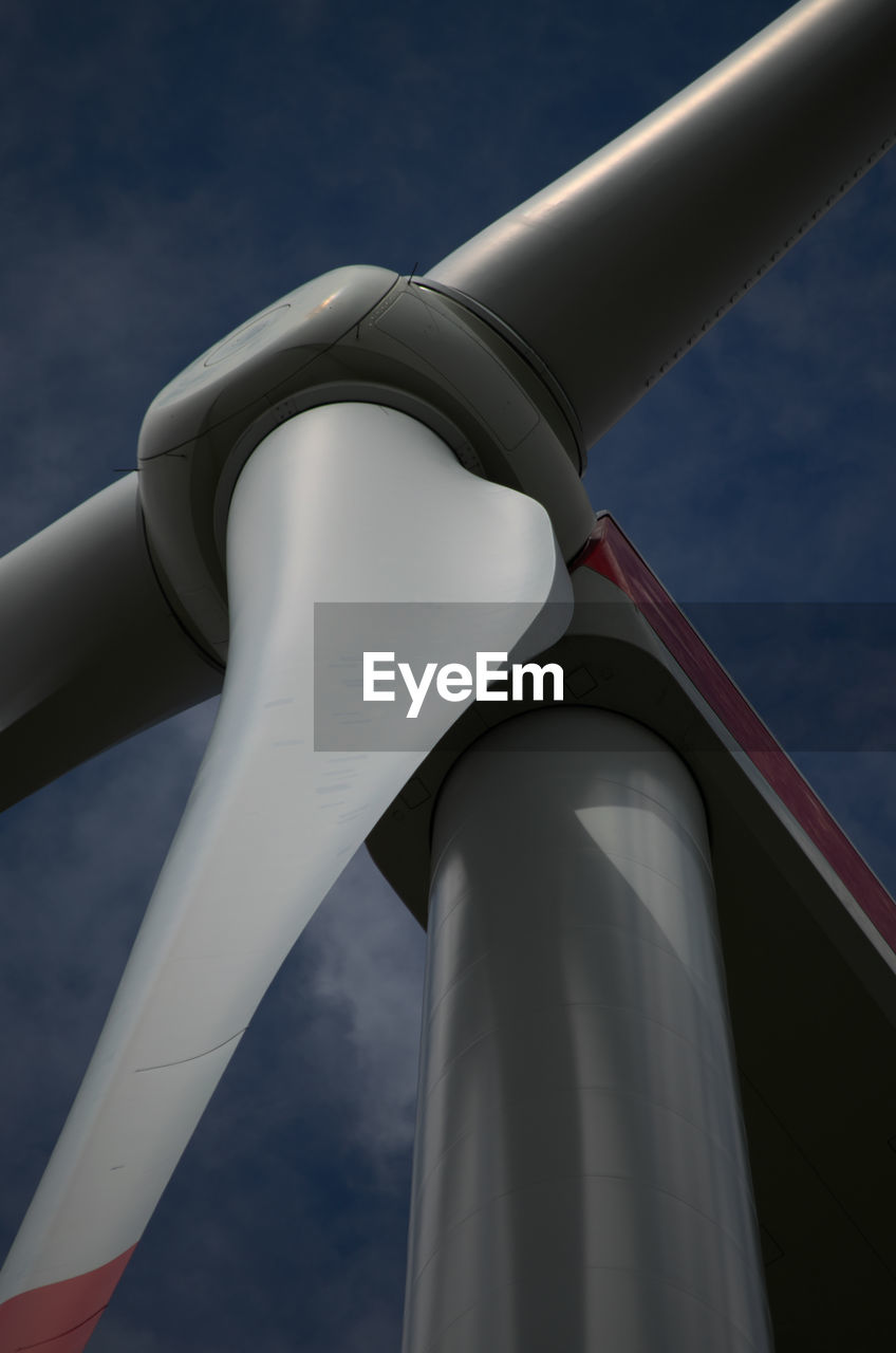 Low angle view of wind turbine against sky