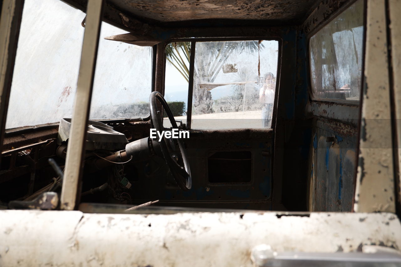 INTERIOR OF OLD ABANDONED CAR