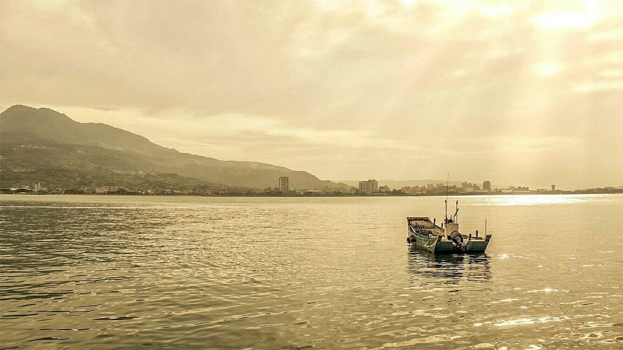 Pedal boat in sea against sky