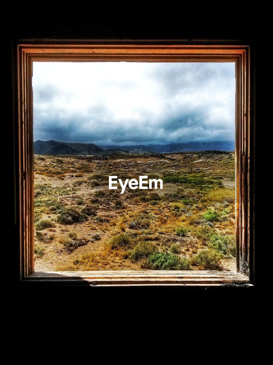 SCENIC VIEW OF LANDSCAPE SEEN THROUGH WINDOW