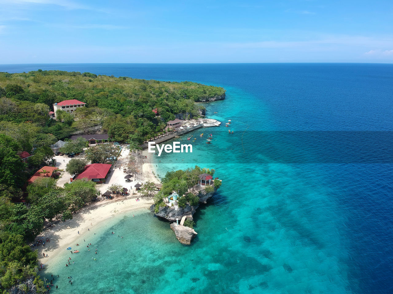 High angle view of sea against blue sky