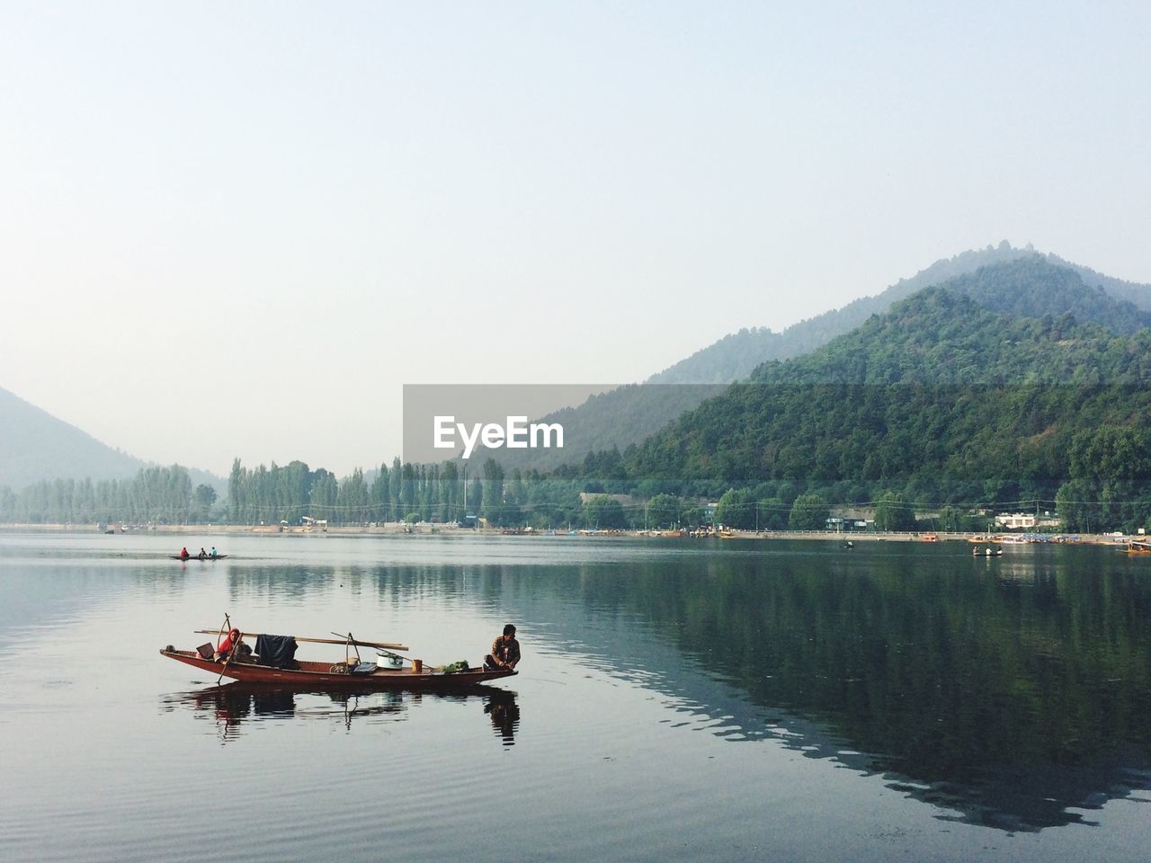 SCENIC VIEW OF LAKE WITH MOUNTAINS IN BACKGROUND