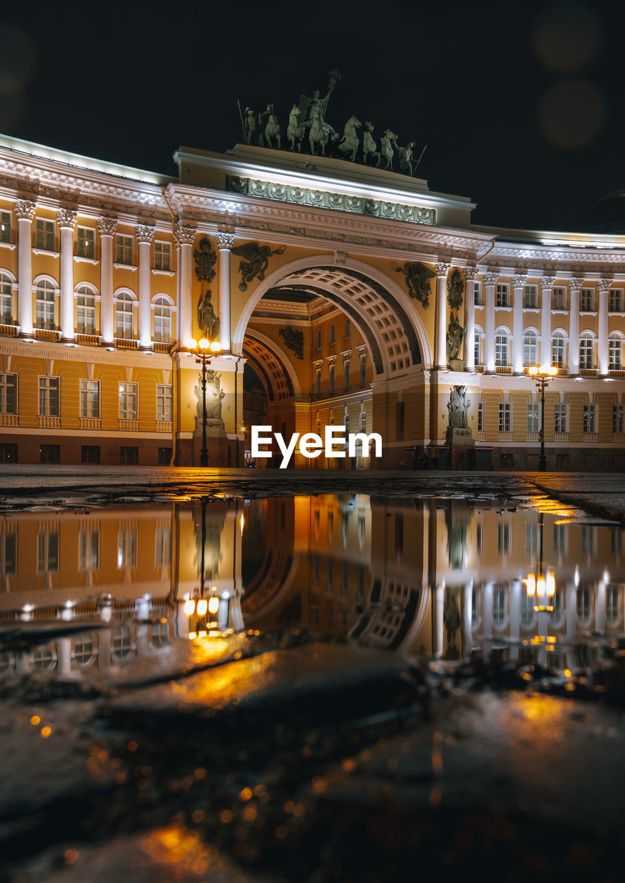  saint petersburg, reflection of illuminated building in water at night