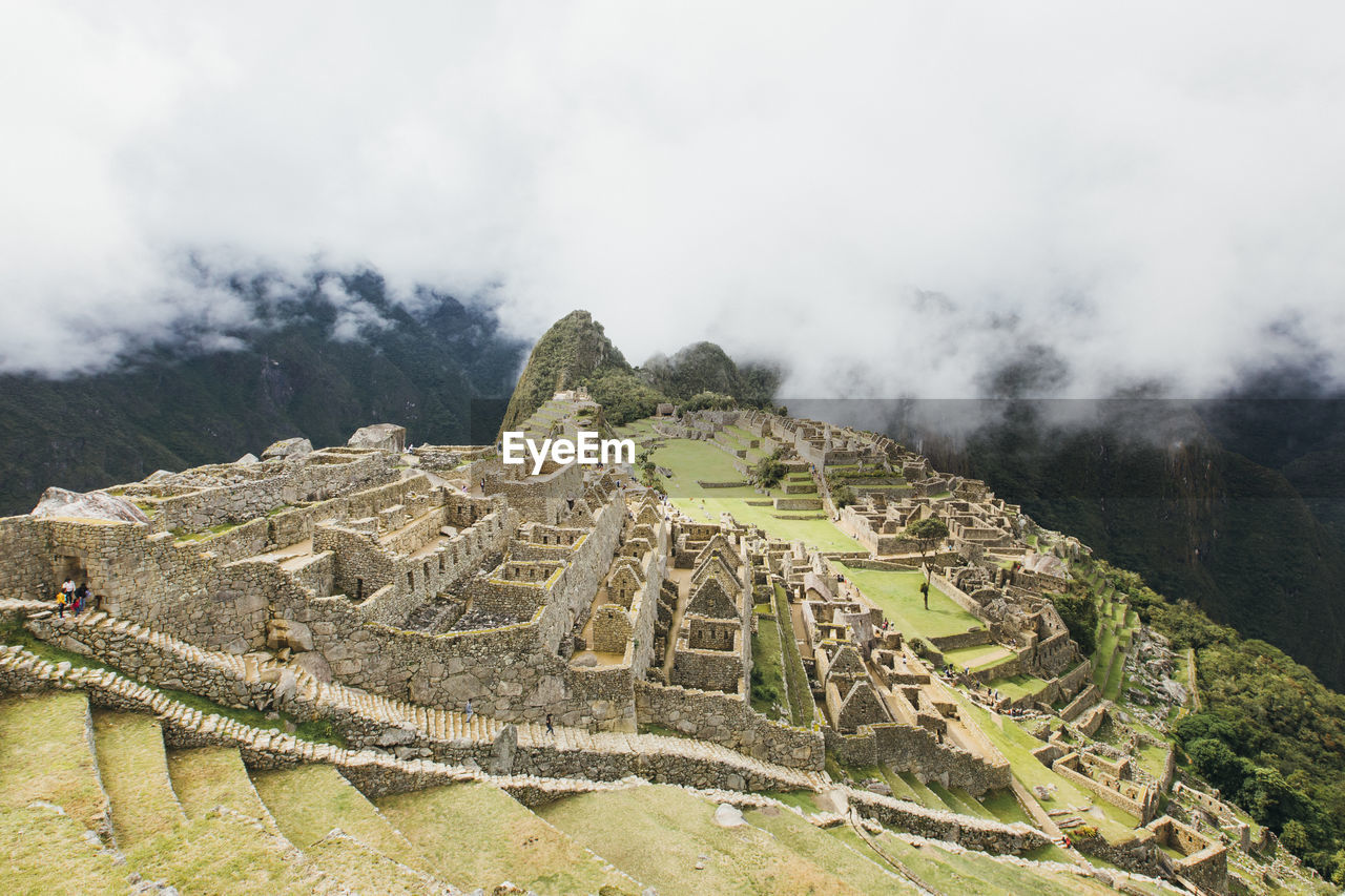 A view of machu picchu in the clouds, peru