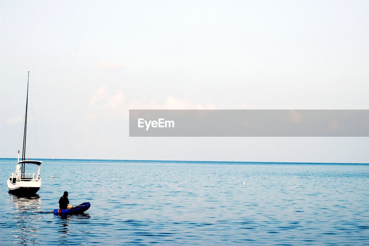 MAN SURFING IN SEA