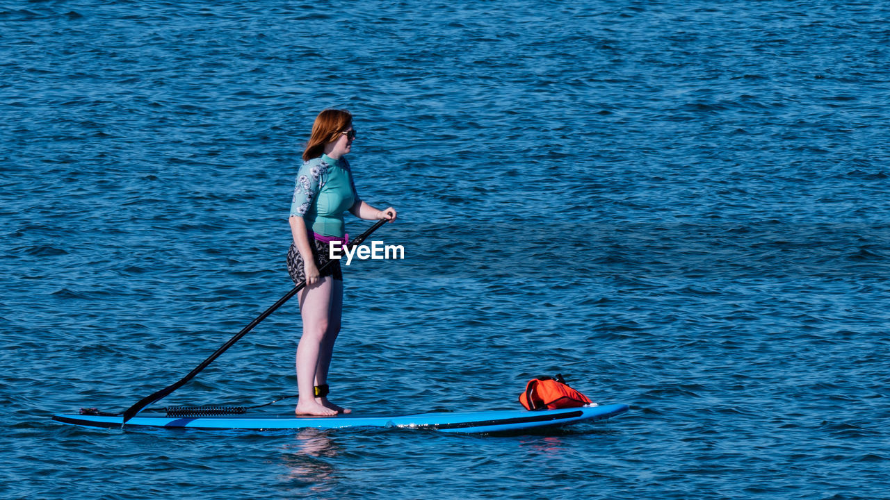 YOUNG WOMAN IN BIKINI