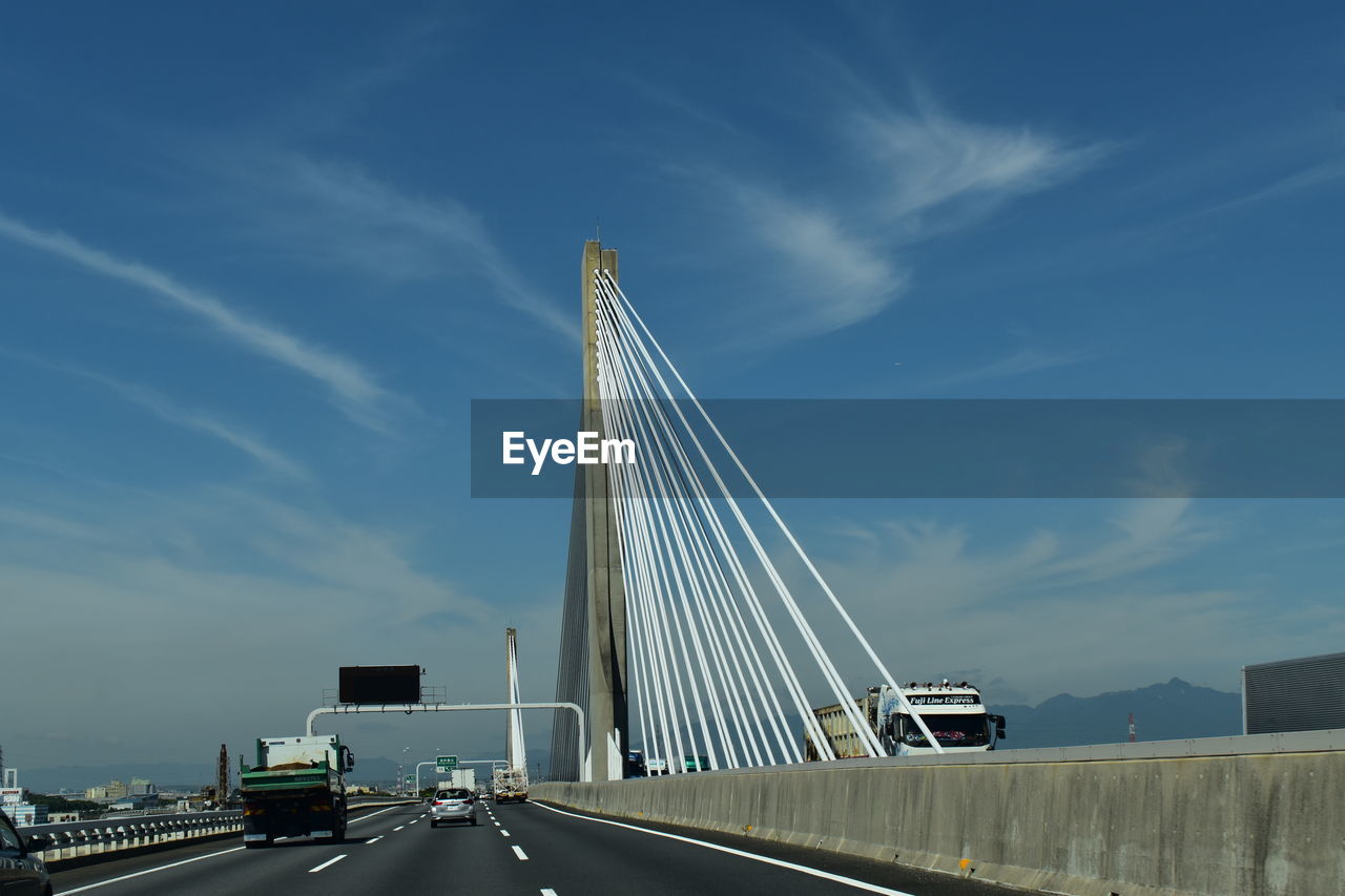 LOW ANGLE VIEW OF BRIDGE AGAINST SKY IN CITY