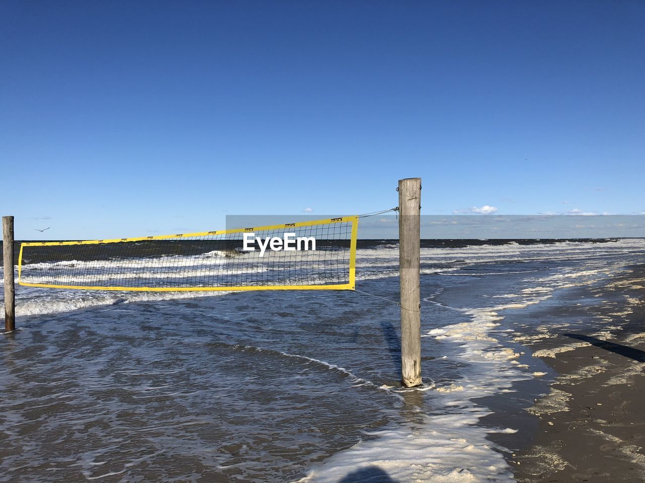 View of volleyball neton beach against sky