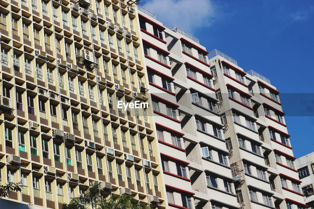 LOW ANGLE VIEW OF RESIDENTIAL BUILDINGS AGAINST SKY