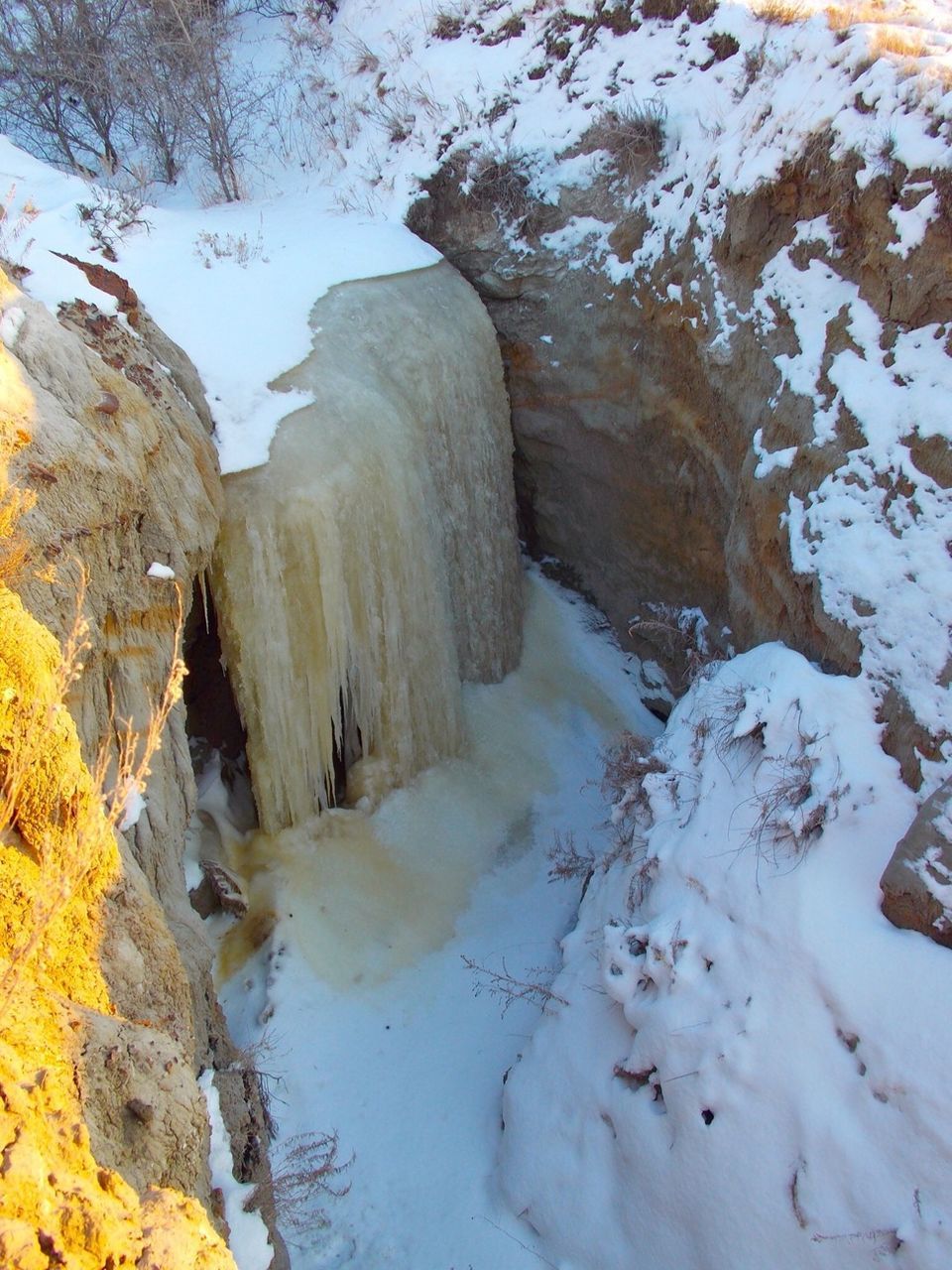 Elevated view of frozen waterfall