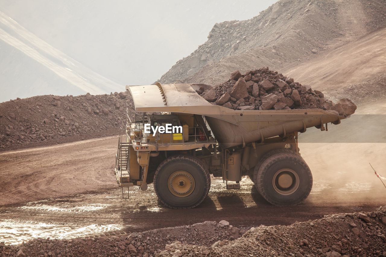 Mining activity, mining dump truck, high angle view of truck working on field