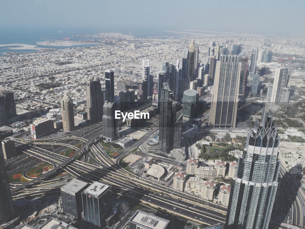 High angle view of modern buildings in city against sky