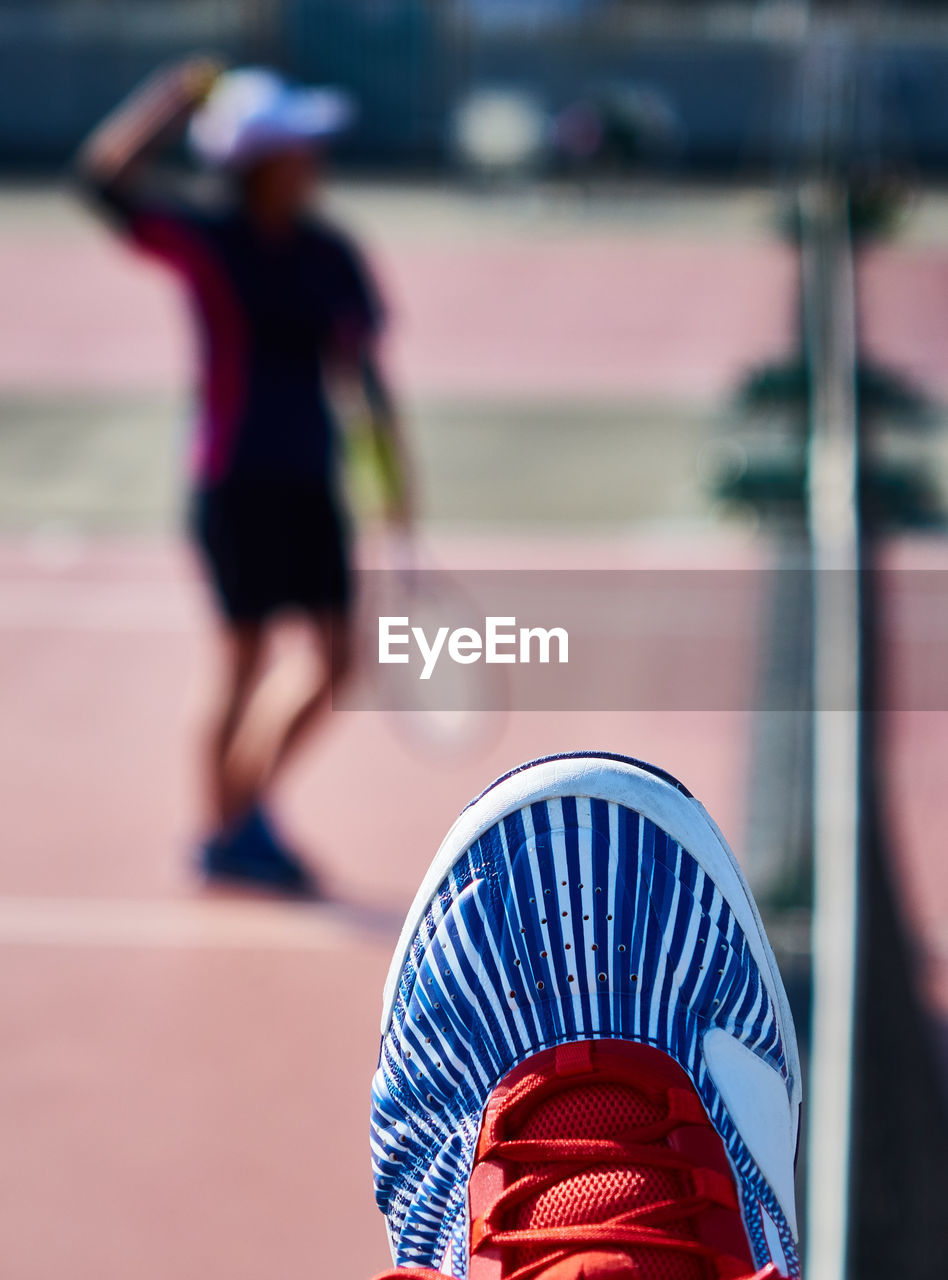 Close-up of shoes against blurred background