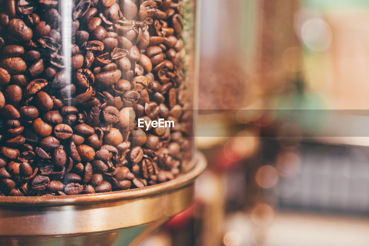 Roasted coffee beans in container at coffee shop