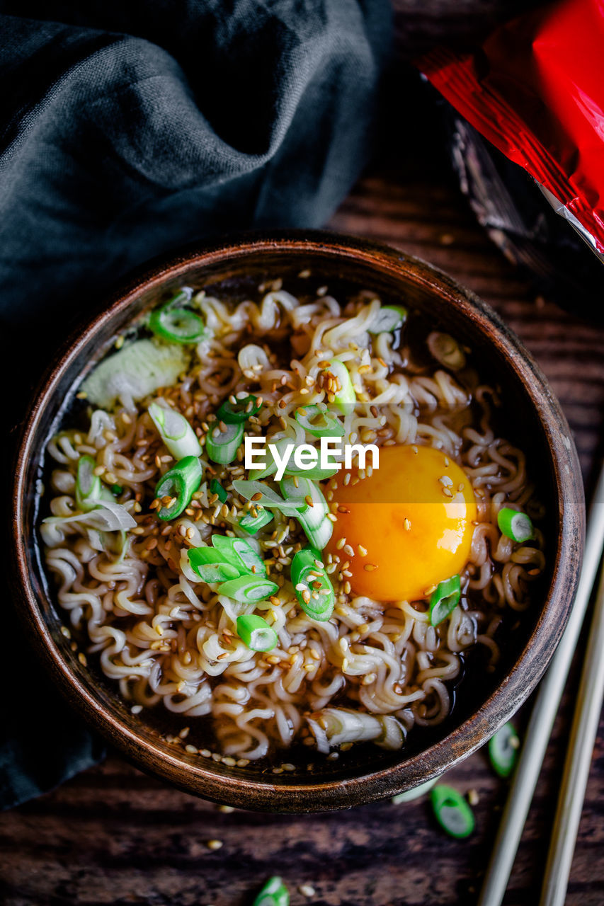 High angle view of bowl with upgraded instant ramen soup