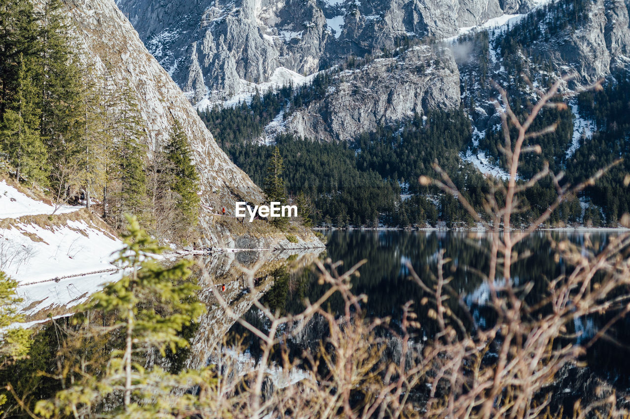 Scenic view of lake and mountains during winter