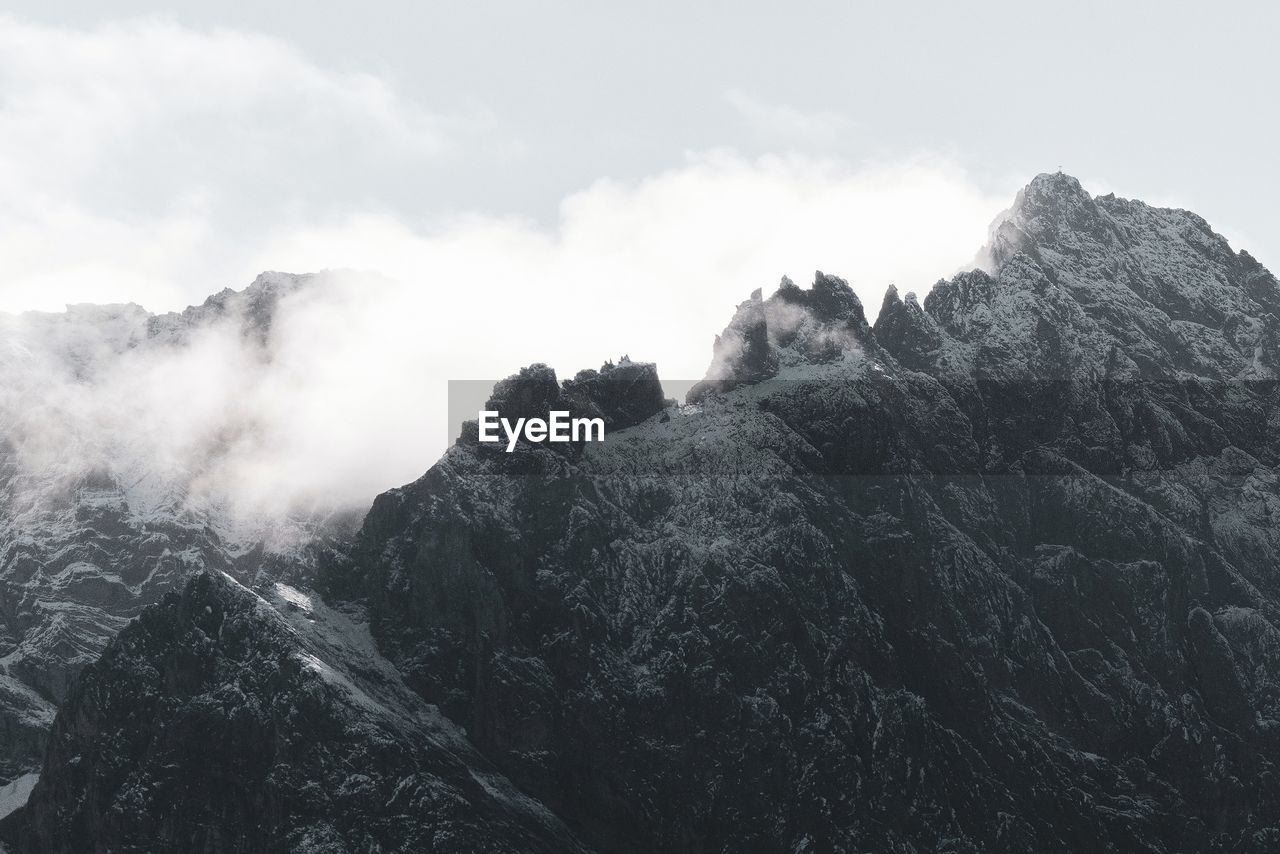 Low angle view of rock formations against sky