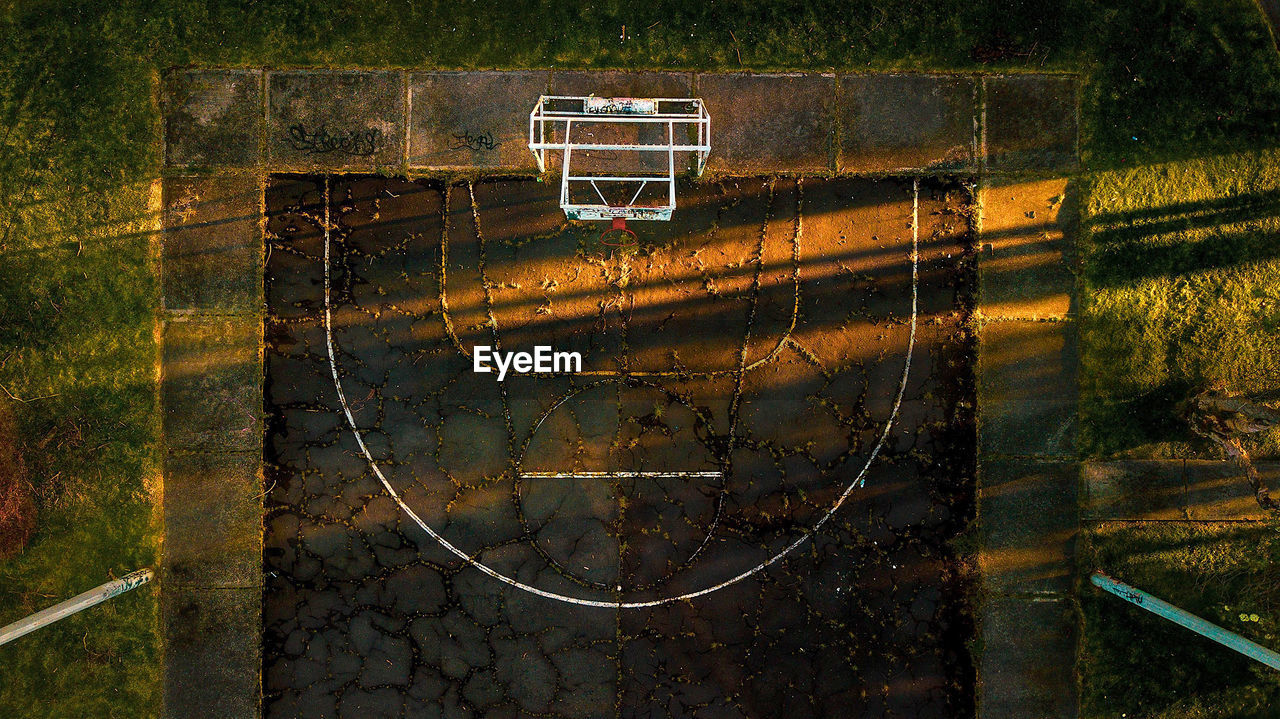 Aerial view of basketball court with players in public park