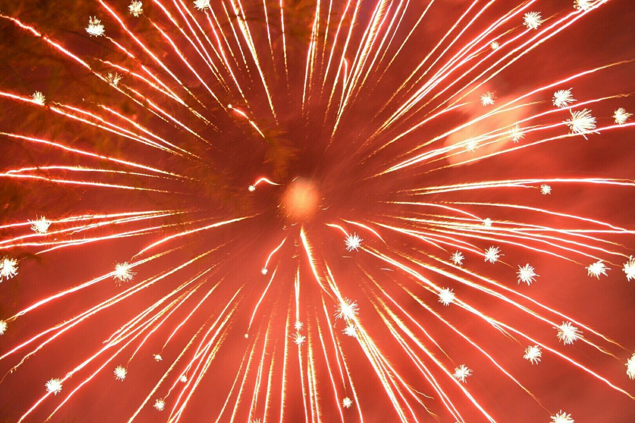 Full frame shot of firework display at night