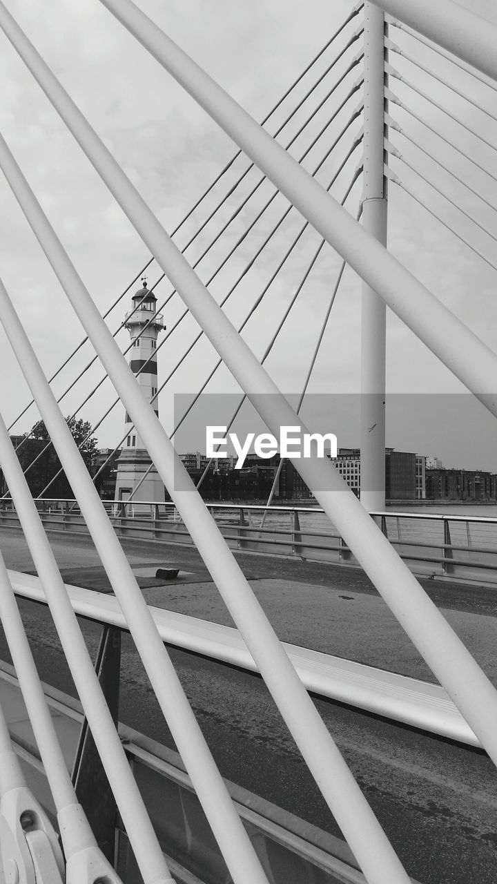 LOW ANGLE VIEW OF SUSPENSION BRIDGE AGAINST SKY