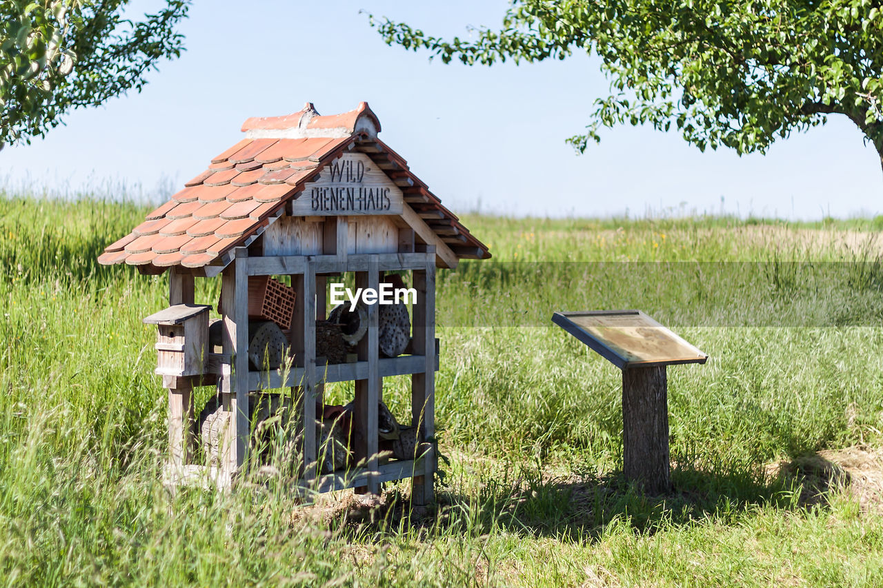 Traditional house on landscape against sky